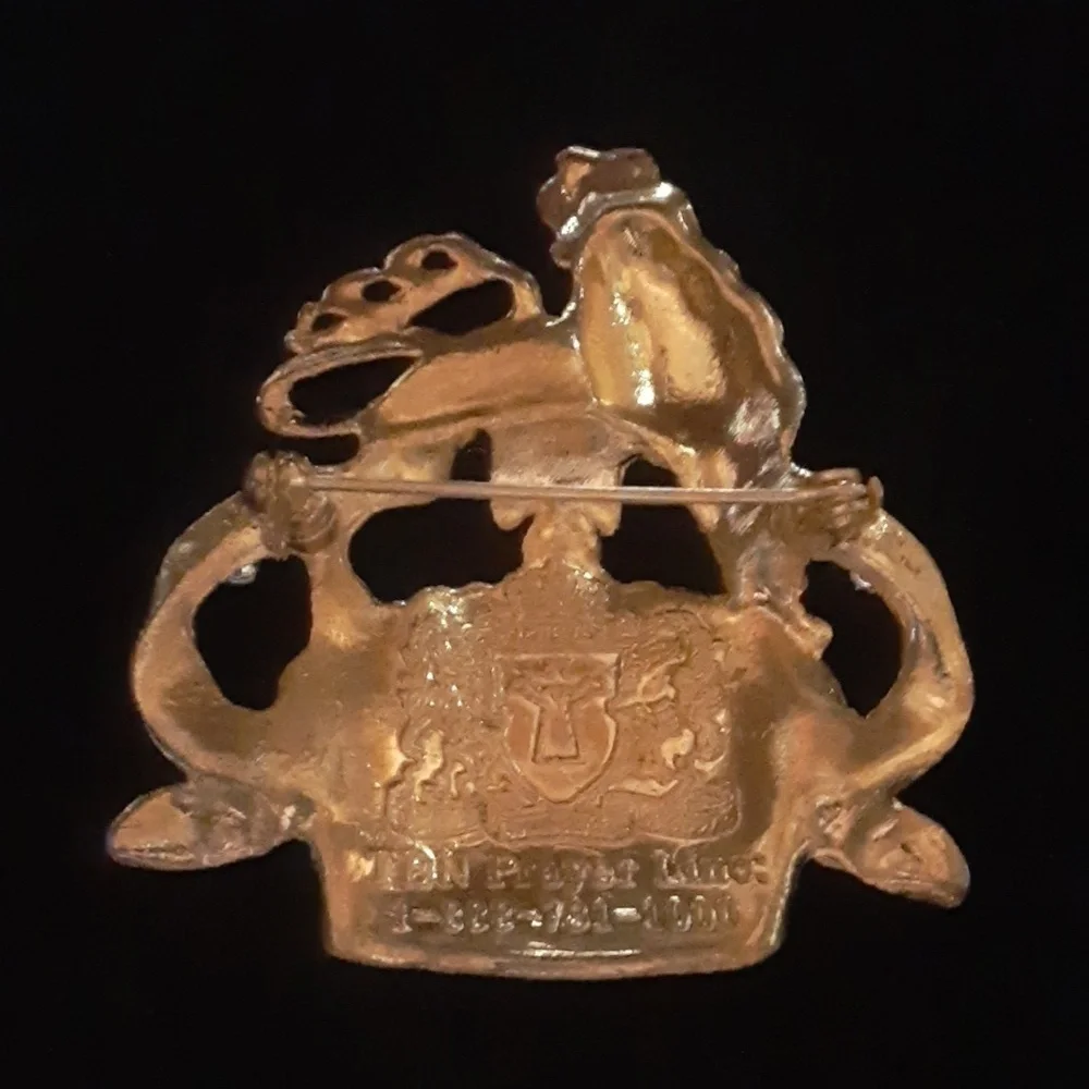 Gold Tone and Purple Lion Crown Brooch